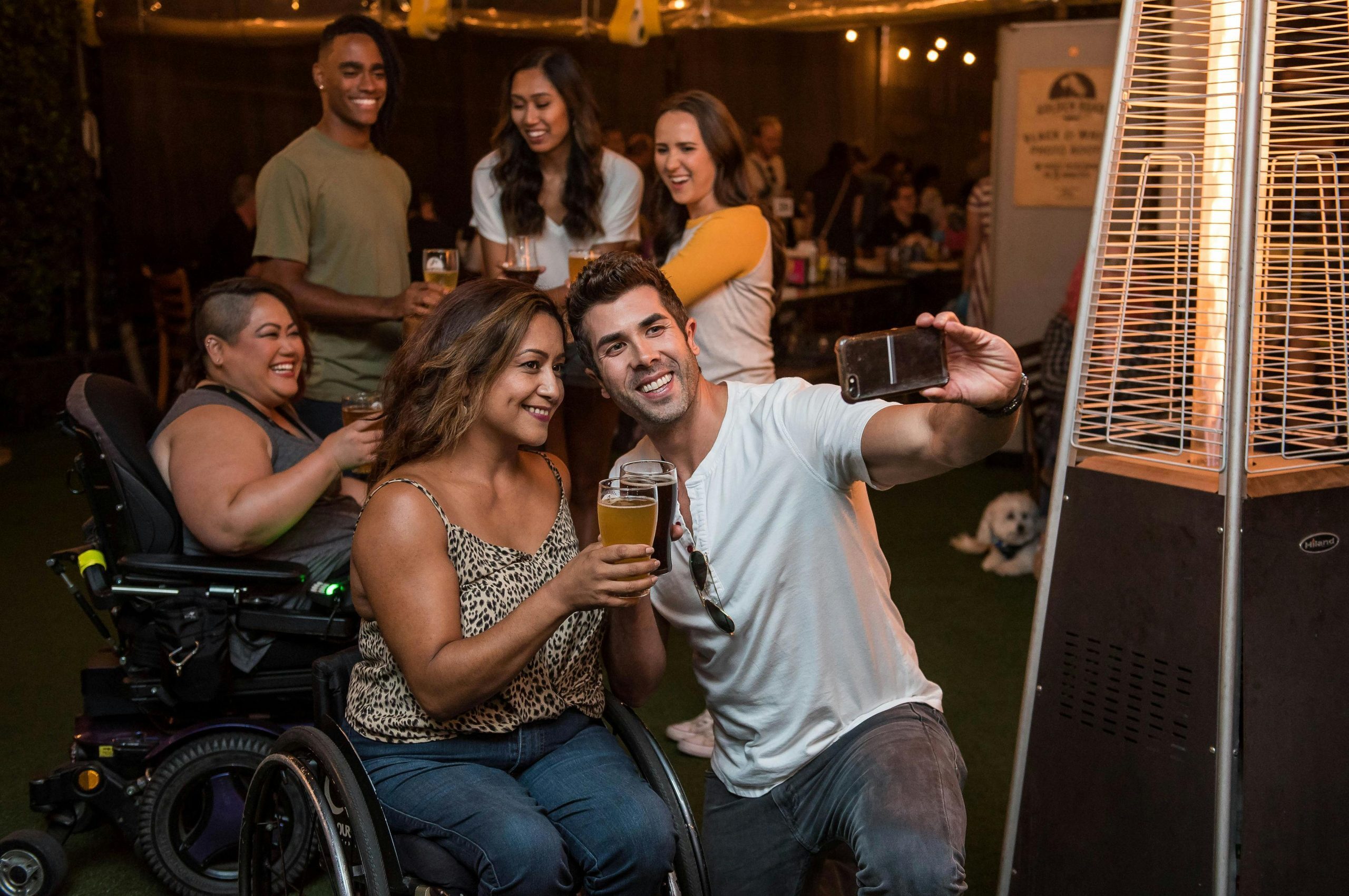 two people taking a photo together at a social event