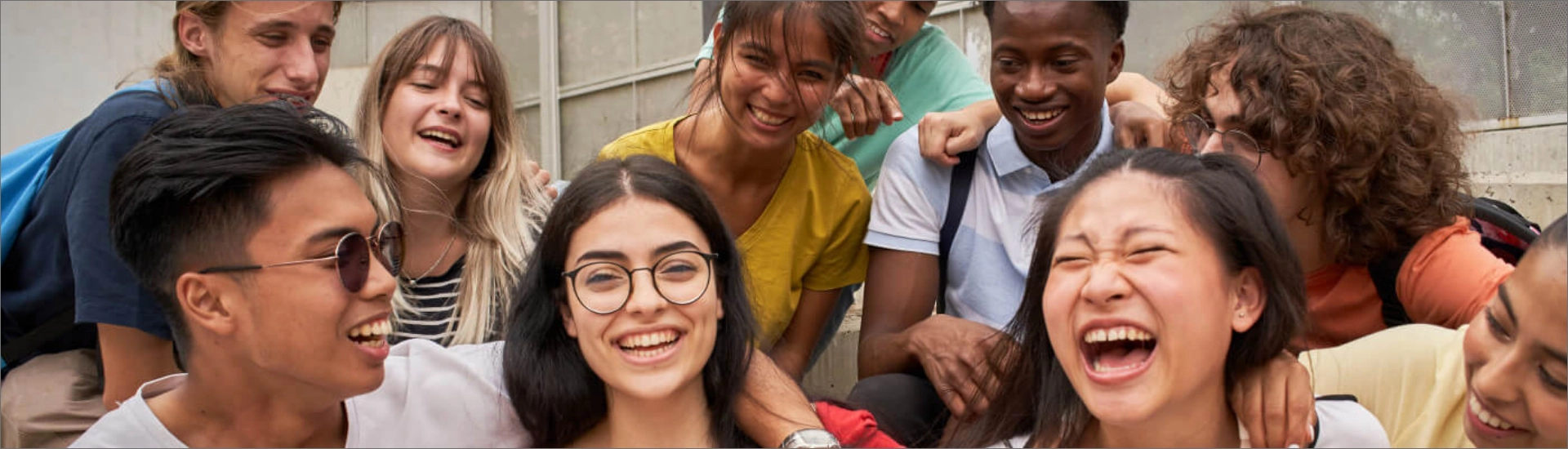 A group of high school students sitting casually and laughing